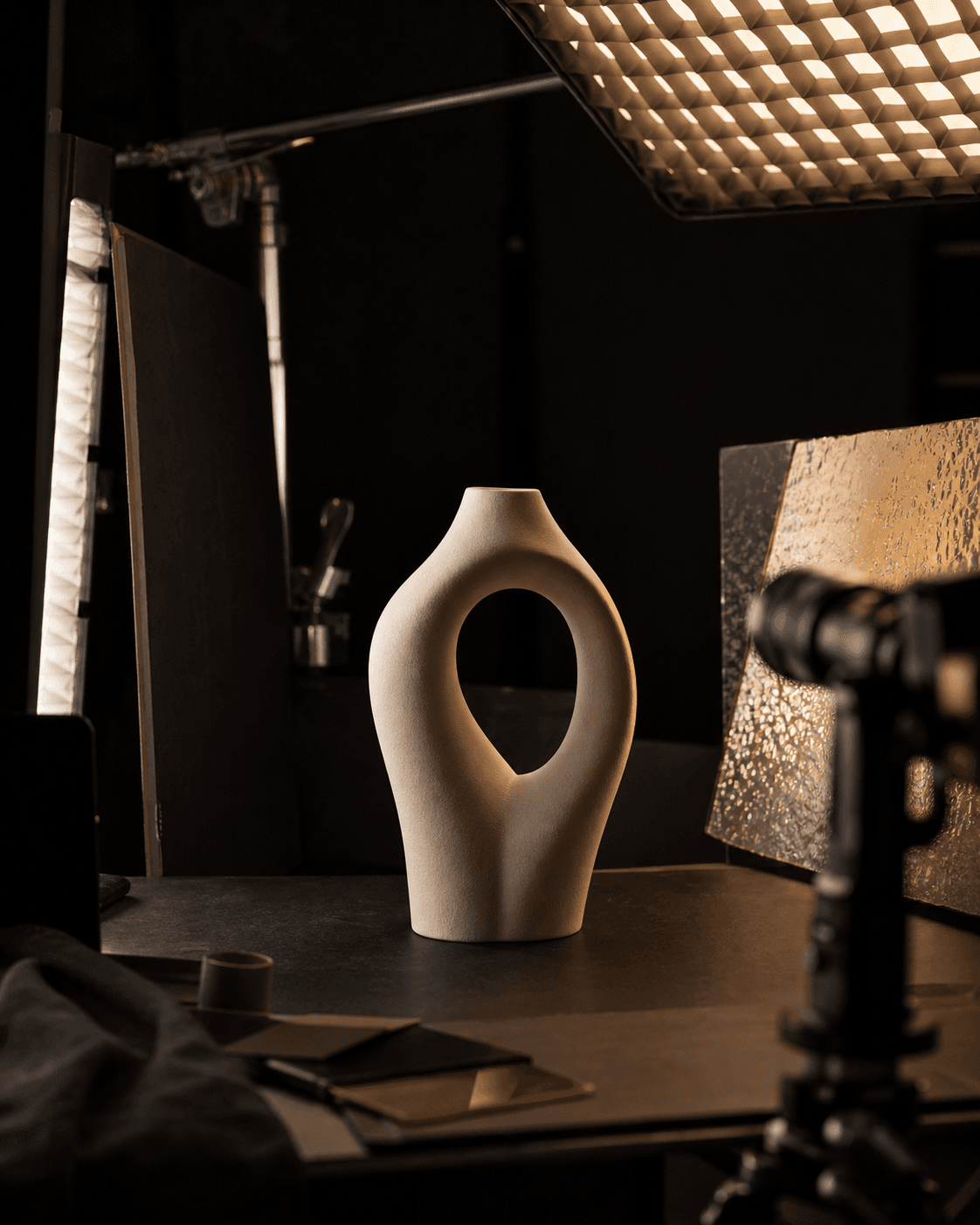 Conceptual commercial-production set with an unbranded sculptural object under controlled studio lighting
